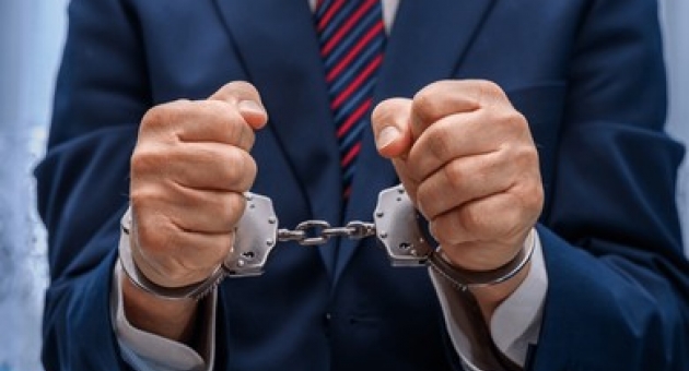 1134_elegantly-dressed-man-suit-handcuffs-260nw-2389412681.jpg